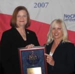 administrators from Presidio School receiving a plaque at the National Blue Ribbon School of Excellence ceremony in Washington DC